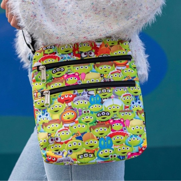 NWT Loungefly Toy Story Alien Outfits AOP Passport Bag - Picture 1 of 5